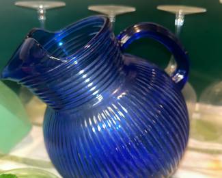Beautiful vintage cobalt glass pitcher and uranium glass fruit juicer