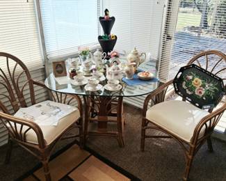 MCM rattan glass top table w/ 2 chairs.  