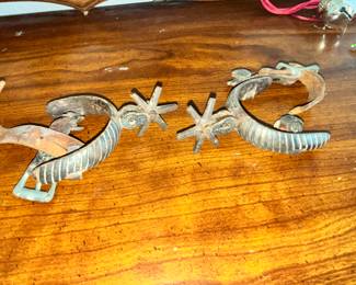ONE OF TWO PAIRS OF ANTIQUE MEXICAN SPURS