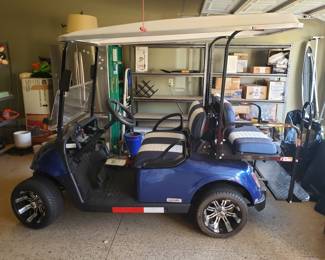 This golf cart is practically in brand new condition. Only driven about 10 times in a neighborhood. Comes road regulated ready - head lights, seat belts, turn signal, horn. 