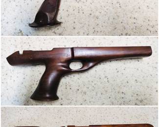A Remington XP-100 stock, Remington XP-100 center-grip stock, and a wooden target rifle stock.