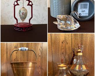Chinese reverse hand-painted glass egg ornament on a carved hardwood stand. A vintage copper coal scuttle bucket,  a retired Swarovski crystal large swan figurine, and a vintage mid-century modern Inland Glass coffee carafes with warming stands. 