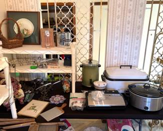 Crock pot, Nesco 18-quart electric roaster oven, vintage West Bend 30-cup automatic coffee maker and a vintage wood and metal washboard