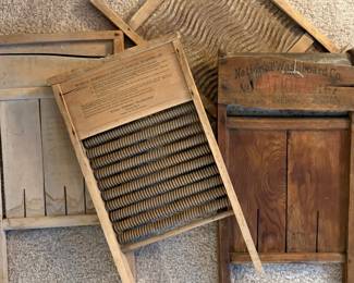 Collection of Antique washboards, including a Mother Hubbard's Patent Roller Washboard and a National Washboard Co. board.