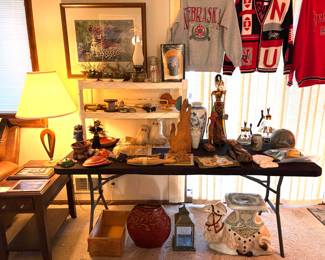 Vintage Husker apparel, Hollywood Regency  hand-painted, glazed ceramic camel plant stand, and a hand carved wood sculpture. 