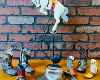 Balance toy Todeo cowboy folk art, copper ash tray/ trinket dish cowboy hat and a collection mini coy boy boot decor. 