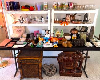 Christmas village, vintage glazed ceramic elephant garden seat, and a rattan end table. 