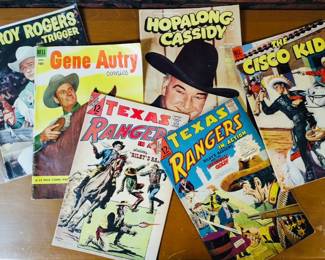 A collection of vintage Western-themed comic books.