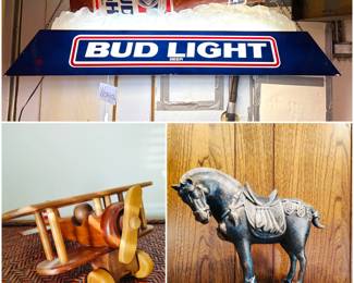  A vintage Bud Light advertising pool table light fixture. A small wooden biplane model and a vintage Asian-style cast iron horse sculpture.