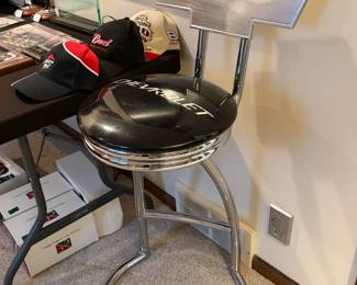 Officially licensed Chevrolet bar or garage stool with a backrest. This stand out piece features a padded seat with the Chevrolet logo. Perfect for any car enthusiasts garage.
Triple chrome-plated steel legs and frame.

