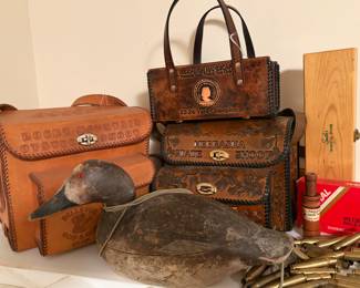 Mason Decoy Company premier grade canvasback hen in original, worn paint. Vintage Shamrock leather trap shooting bags. 