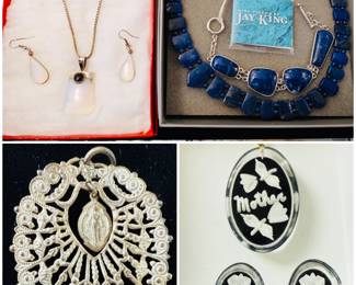 A sterling silver moonstone teardrop pendant necklace and matching earrings set. A large ornate silver-tone pendant, Jay King sterling silver and lapis lazuli necklace and a vintage reverse-carved butterfly glass pendant and earrings set.