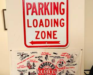 Aluminum No Parking sign and a humorous illustrations and text snippets related to common misfortunes or excuses in the sport of trap shooting.