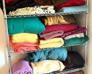 A Large Number Of Vintage New Blankets