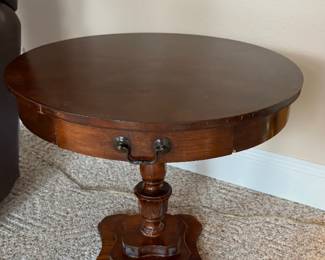 Georgian-style mahogany round pedestal drum side table with a drawer.