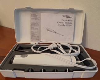 Hamilton Beach electric knife with a storage case.