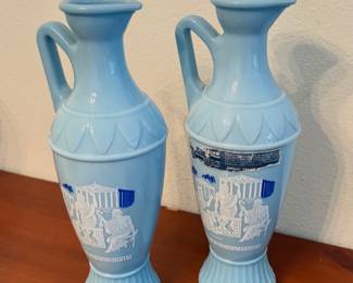 Two 1961 Jim Beam blue milk glass Grecian decanters.
