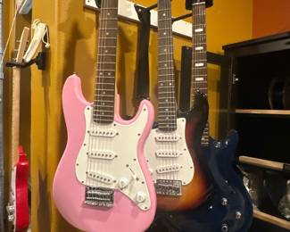 In Online Auction - Fender Squire Mini: Pink ¾ scale right handed electric guitar