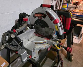 Craftsman 10-inch corded folding compound miter saw on stand.