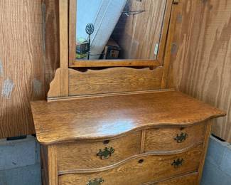 Great condition! Solid wood dresser with curved drawers and attached mirror.