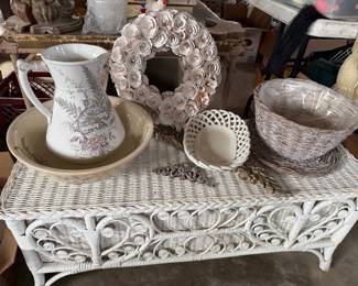 Antique wash basin, various antique glassware, baskets, and decor.