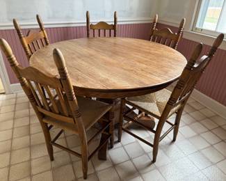 Rustic, solid wood kitchen table with 6 chairs (5 in great condition, 1 needing seat repair).