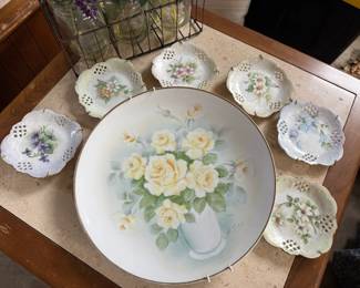 Hand-painted vintage plates with plate hangers.