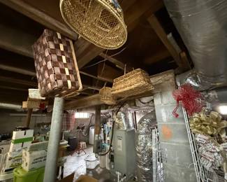 Collection of woven baskets, crafting supplies, and handmade wreaths.