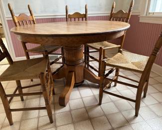 Rustic, solid wood kitchen table with 6 chairs (5 in great condition, 1 needing seat repair).