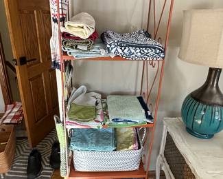 Metal shelving unit and linens.....