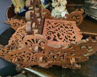 Handmade wooden sewing basket with intricate fretwork and scrollwork.