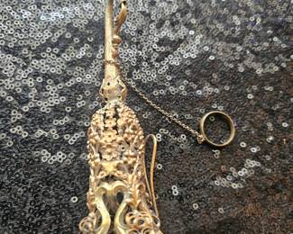 Victorian filigree posy holder or chatelaine accessory with floral motifs.