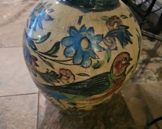 A hand-painted ceramic vase from the Persian Qajar Dynasty.