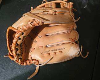 This is a vintage Wilson "Action Snap" baseball glove with "CY YOUNG AWARD WINNER" inscription.