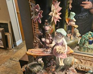 A 19th-century Continental Majolica vase with figural and floral decoration.