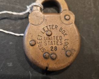 Antique brass United States Street Letter Box lock, number 28.