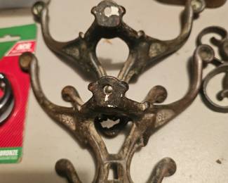 Antique cast iron Victorian-style multi-prong coat hook with '1903' marking.