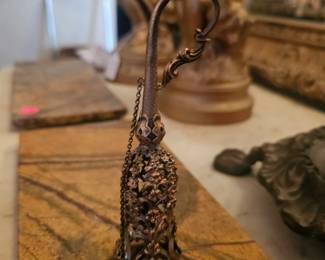 A Victorian silver filigree posy holder with chain and ring.