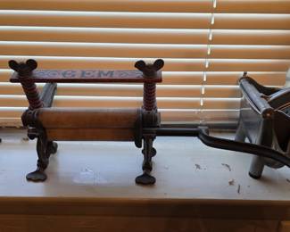 Antique cast iron and wood clothes wringer, likely a salesman's sample.