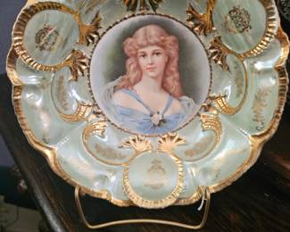 Antique German porcelain decorative plate with a portrait of a woman.