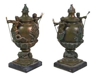 Cast metal urns, with mythological motifs, on square bases