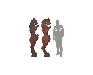 Pair of carved wooden corbels depicting mythological creatures 