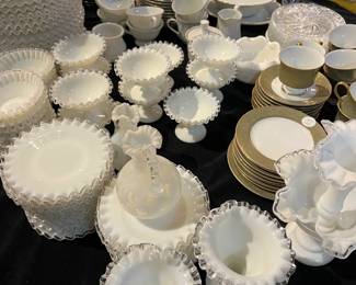 Collection of Czechoslovakian cobalt glass featuring deep blue and emerald green pieces with gold gilt and hand-painted floral decoration. Includes vases, pitchers, and matching drinking glasses. Elegant European glassware ideal for display or use, with rich color and decorative detailing throughout.