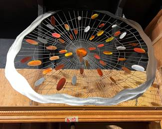 Curtis Jere-style metal wall sculpture featuring a dynamic sunburst design with wire construction and multicolored enamel accents. Sculptural mid-century modern wall art with strong visual impact. Multiple examples available, offering a variety of sizes and compositions—ideal for collectors, designers, or statement interiors.