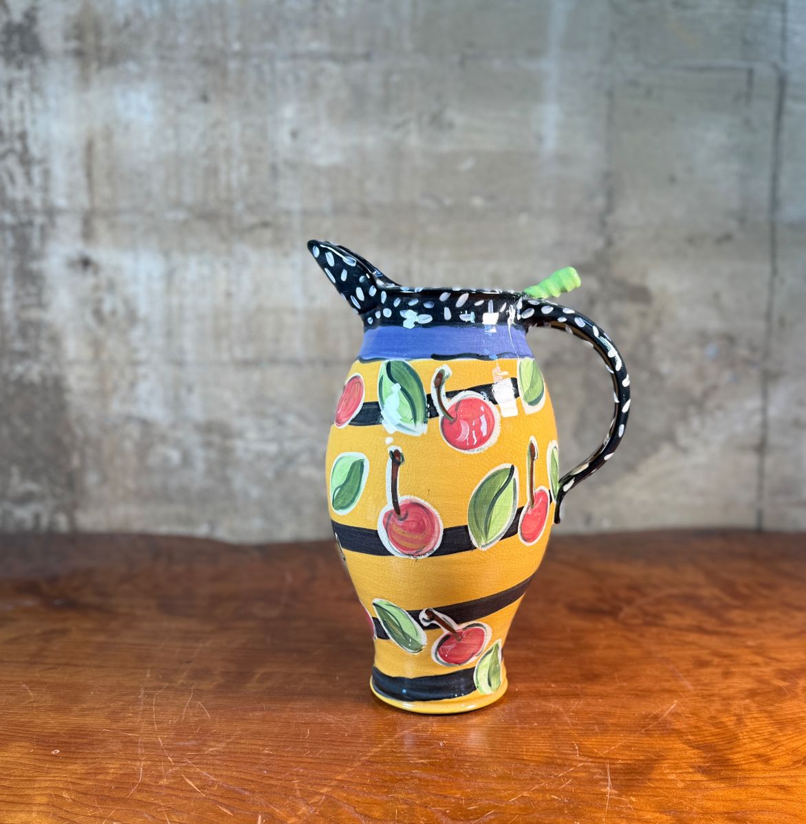 This lot features a studio made pitcher by listed Oregon artist, Mary Lou Zeek. Signed underneath and measures, 13” H x 9” W x 7” D.

