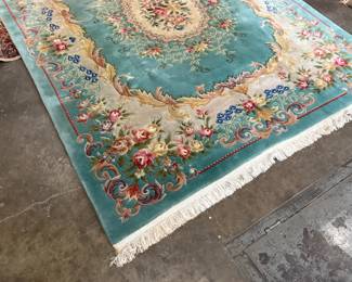 This lot features a hand-knotted Chinese Aubusson wool rug featuring a floral medallion design that measures, 144” H x 107” W.

