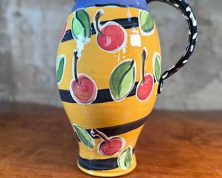This lot features a studio made pitcher by listed Oregon artist, Mary Lou Zeek. Signed underneath and measures, 13” H x 9” W x 7” D.

