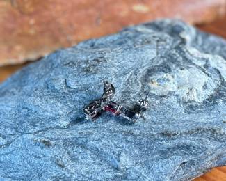 This lot features a pair of ruby and diamond ribbon stud earrings designed by, Sonia Hou. SONIA, a Los Angeles based Chinese American jewelry designer and fashion enthusiast, always had trouble finding stylish, reasonably priced jewelry that was safe on her skin and long-lasting in the sense that it will not easily flake. She would shop at major retailers and overspend on jewelry made out of cheap metals that would cause her allergic skin reactions.

