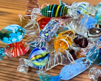 This lot features a large collection of Murano blown glass candy. Majority are in very good condition, some still with maker sticks as seen in photos.

