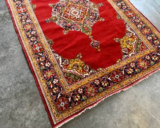 This lot features an antique handwoven Persian rug that measures, 74” H x 49” W.

